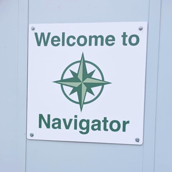 An image of the "Welcome to Navigator" signage.